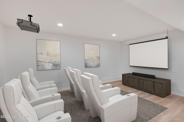 home theater with light wood-type flooring