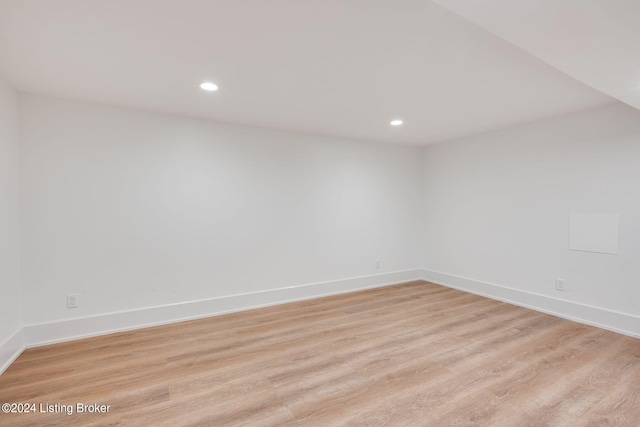 unfurnished room with light wood-type flooring