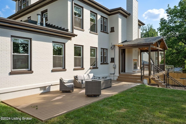 back of house with a lawn and an outdoor hangout area