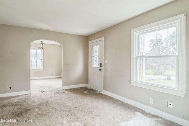 view of carpeted foyer