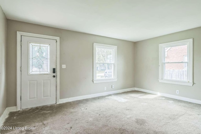 entryway featuring carpet flooring