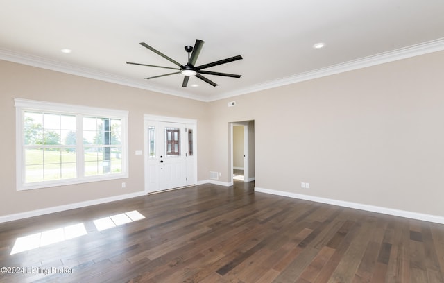 empty room featuring dark hardwood / wood-style flooring, ceiling fan, and ornamental molding