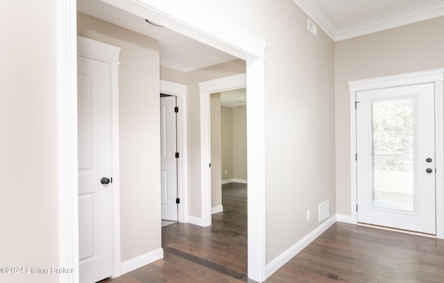 foyer entrance with dark wood-type flooring and ornamental molding