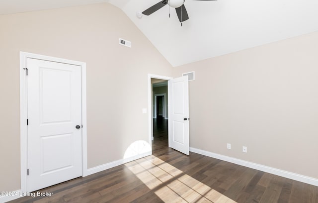 unfurnished bedroom featuring ceiling fan, dark wood-type flooring, and high vaulted ceiling