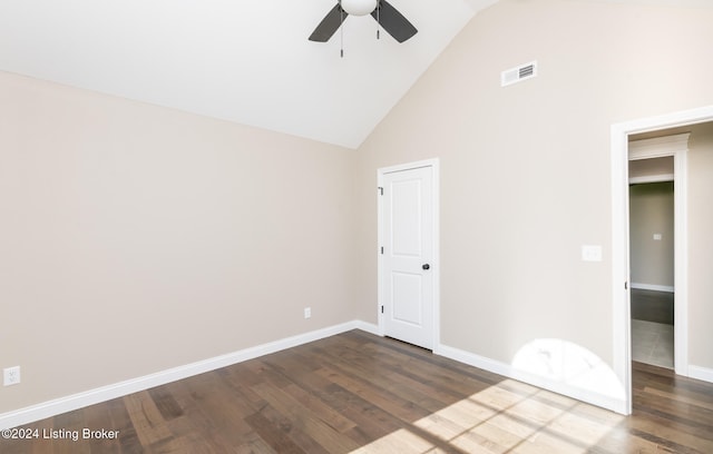 unfurnished bedroom with ceiling fan, a spacious closet, high vaulted ceiling, dark hardwood / wood-style floors, and a closet