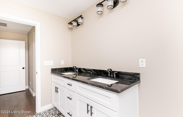 bathroom featuring vanity and wood-type flooring