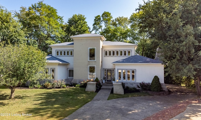 prairie-style house with a front yard