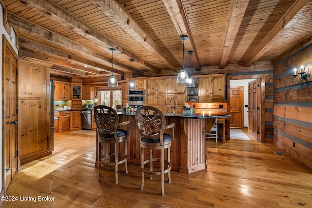 bar with light hardwood / wood-style floors and wooden walls