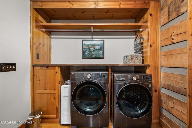 washroom with washer and dryer and wooden ceiling