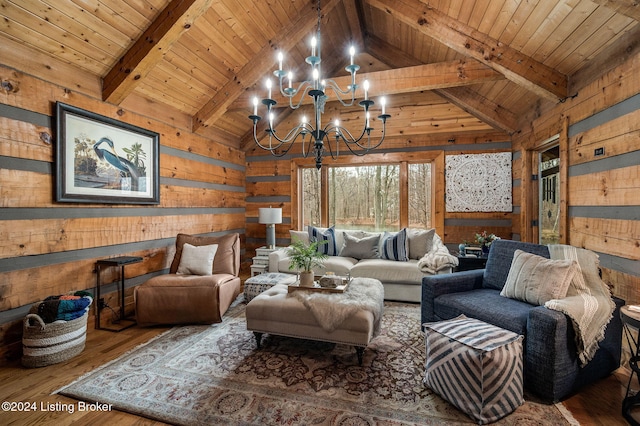 living room with wooden walls, beam ceiling, hardwood / wood-style flooring, wooden ceiling, and a chandelier