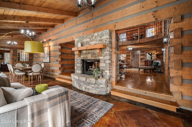 living room with wood walls, a stone fireplace, beamed ceiling, wood ceiling, and a chandelier