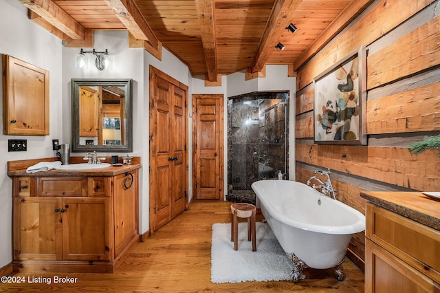 bathroom with plus walk in shower, hardwood / wood-style floors, wood ceiling, and beam ceiling