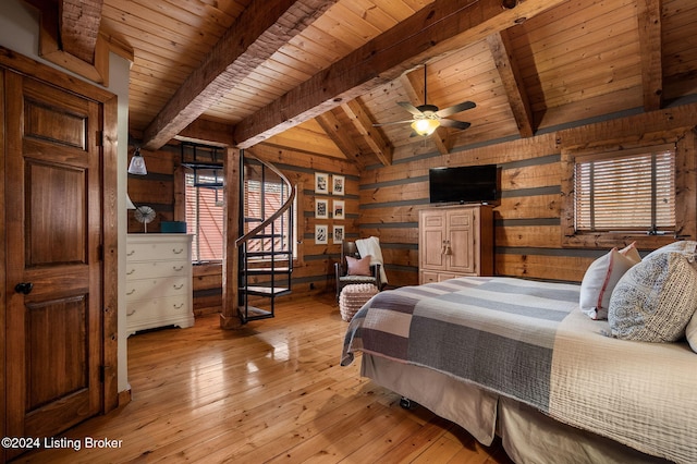 bedroom with ceiling fan, wooden ceiling, lofted ceiling with beams, wood walls, and light hardwood / wood-style floors