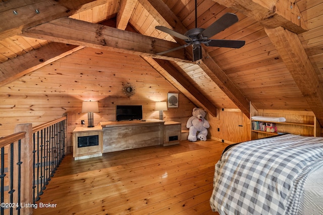 unfurnished bedroom featuring ceiling fan, wooden ceiling, vaulted ceiling with beams, wood walls, and light wood-type flooring