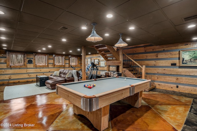 playroom with billiards and wooden walls