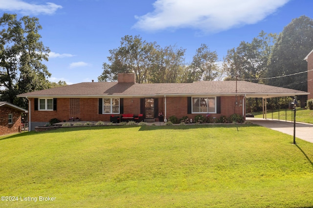 single story home with a front lawn and a carport