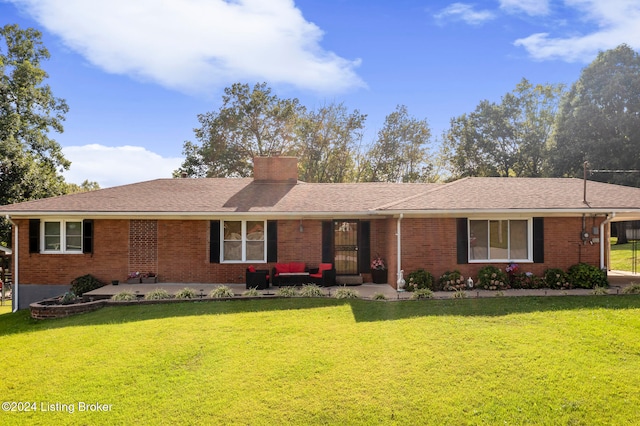 single story home featuring a patio and a front lawn