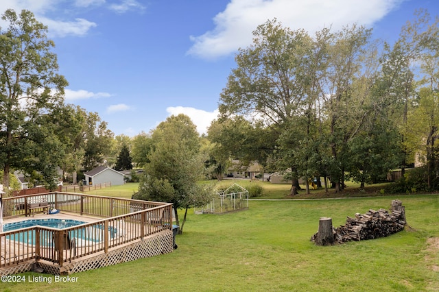 exterior space featuring a lawn and a deck