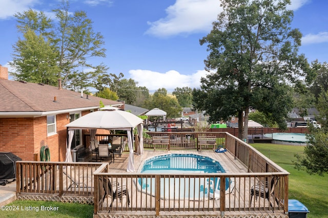 view of pool featuring a patio and grilling area