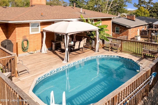 view of swimming pool with a deck