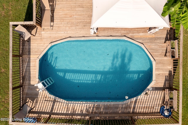 view of swimming pool featuring a wooden deck