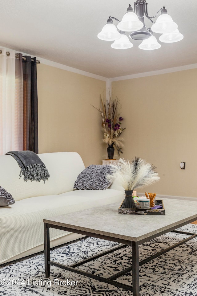 carpeted living room featuring ornamental molding and a chandelier