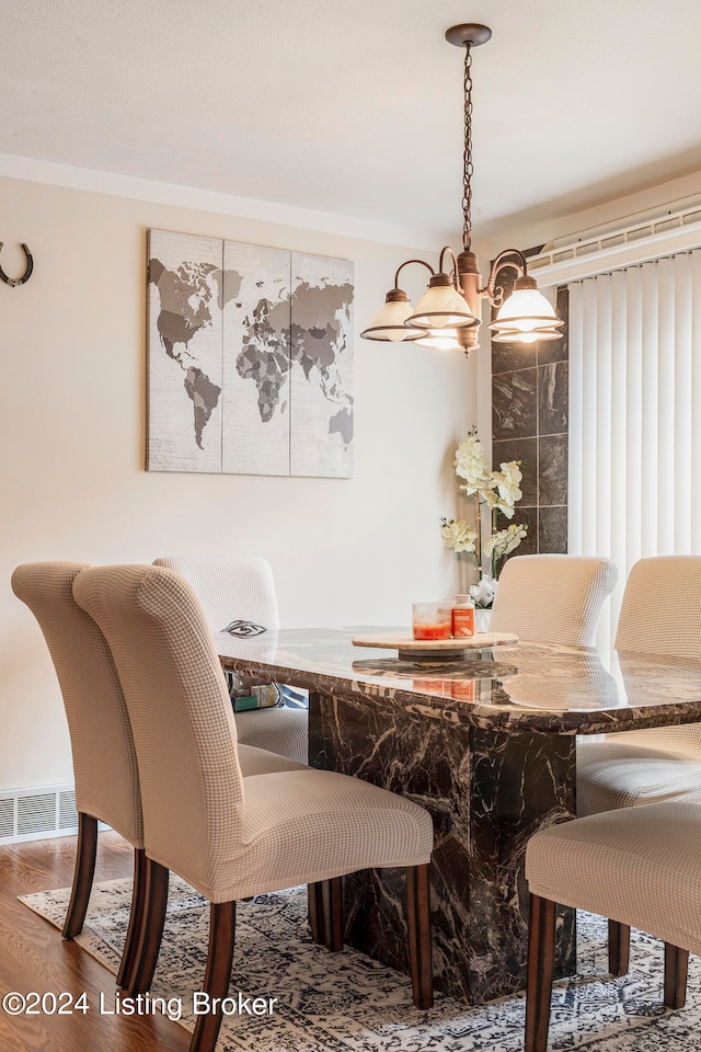 dining room featuring breakfast area and hardwood / wood-style floors