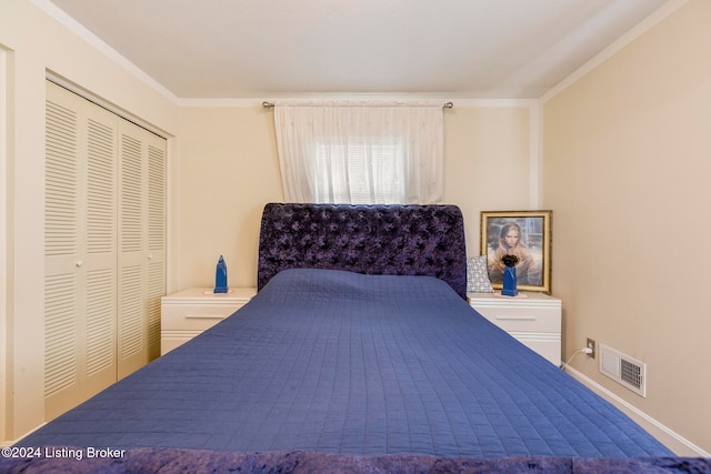 bedroom with a closet and crown molding