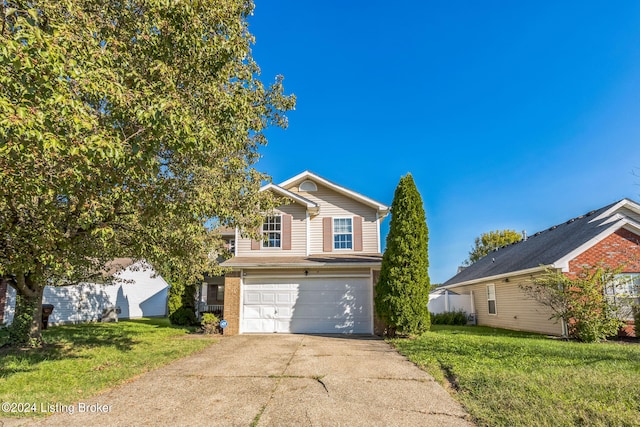 front facade featuring a front yard and a garage