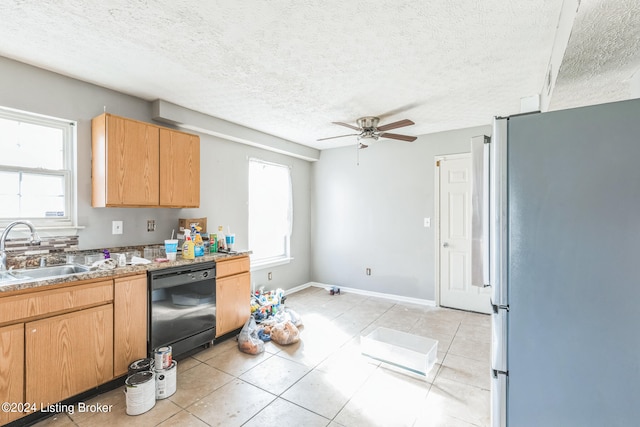 kitchen with black dishwasher, sink, a textured ceiling, and white refrigerator