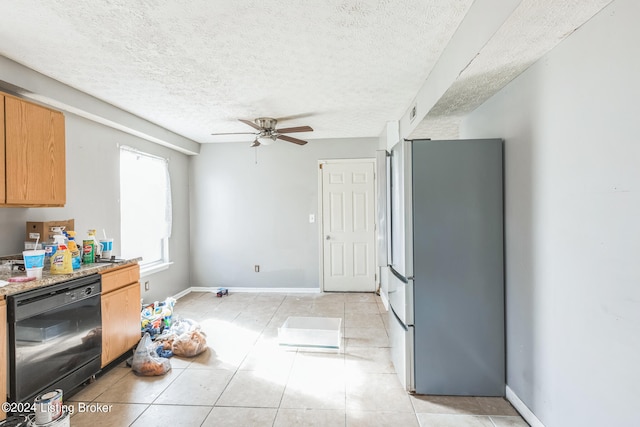 kitchen featuring dishwasher, a textured ceiling, ceiling fan, stainless steel refrigerator, and light tile patterned floors