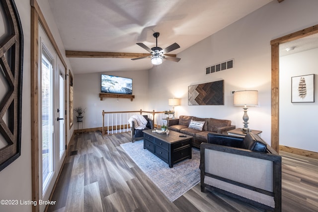 living room with ceiling fan, lofted ceiling with beams, and dark hardwood / wood-style flooring