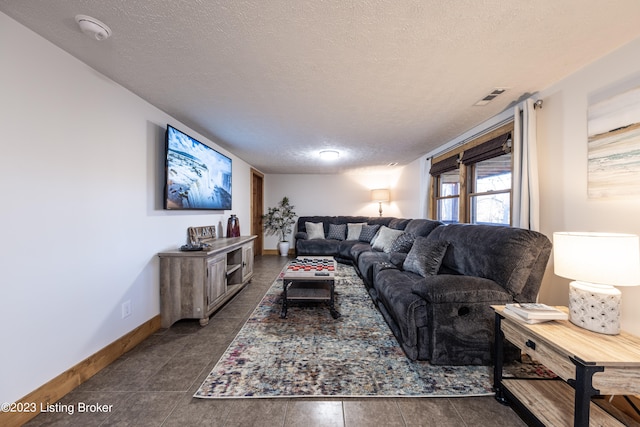 tiled living room with a textured ceiling