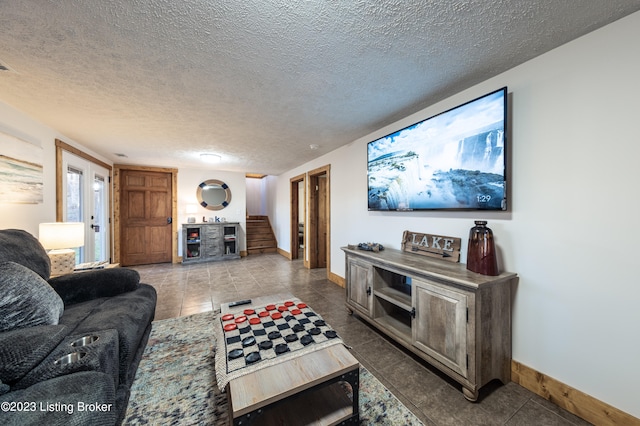 tiled living room with a textured ceiling