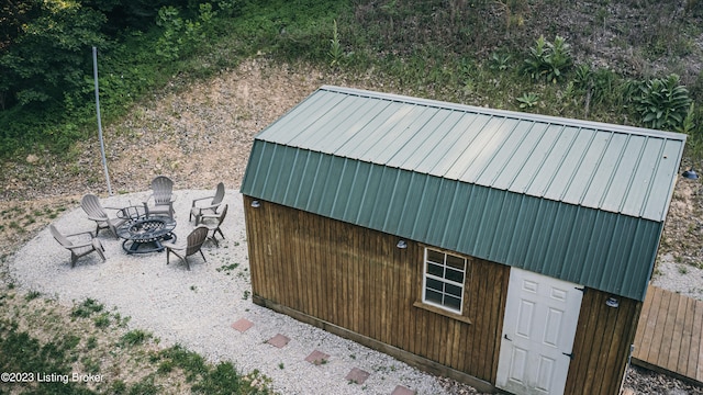 view of outdoor structure featuring a fire pit