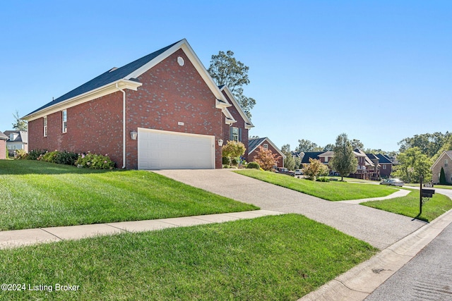 view of side of home featuring a garage and a lawn