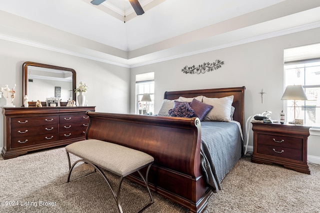 bedroom with ceiling fan, light carpet, and ornamental molding