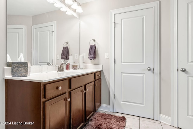 bathroom with vanity and tile patterned floors