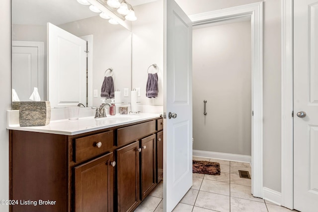 bathroom with vanity and tile patterned flooring