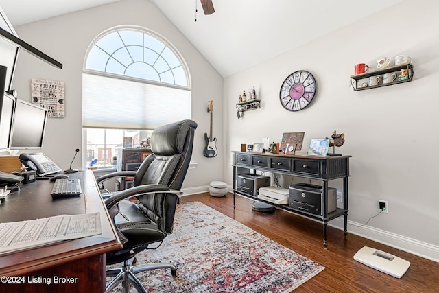 home office with ceiling fan, dark hardwood / wood-style flooring, and high vaulted ceiling