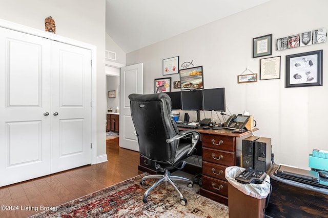 office area featuring vaulted ceiling and dark hardwood / wood-style floors