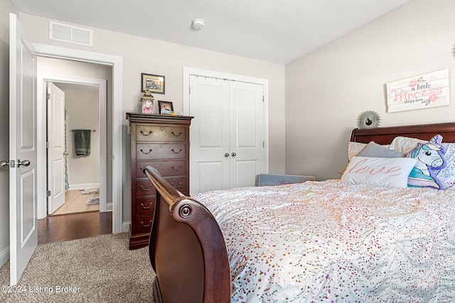 carpeted bedroom with a closet