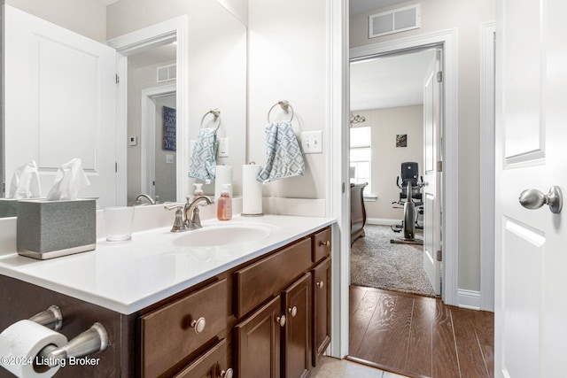 bathroom featuring wood-type flooring and vanity