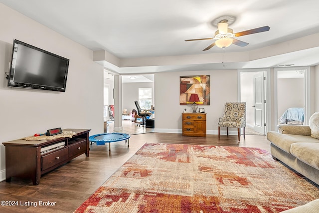 living room with ceiling fan and hardwood / wood-style floors