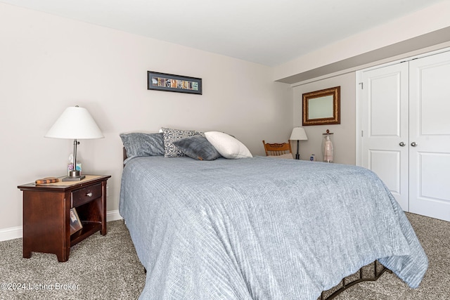 bedroom featuring a closet and carpet floors