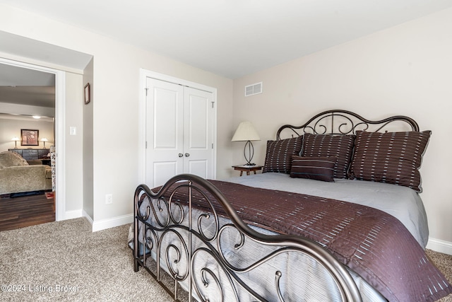 bedroom with a closet and carpet flooring