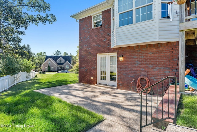 exterior space with a patio area and a yard