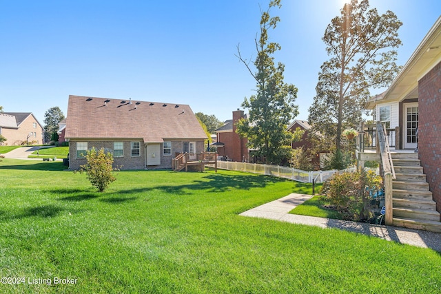 view of yard with a wooden deck