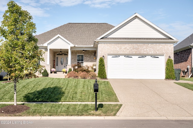 view of front facade with a garage and a front lawn