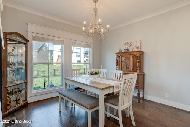 dining area with crown molding, a chandelier, and dark hardwood / wood-style floors